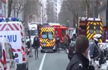 Policewoman dies after being shot at in Paris; explosions near mosques